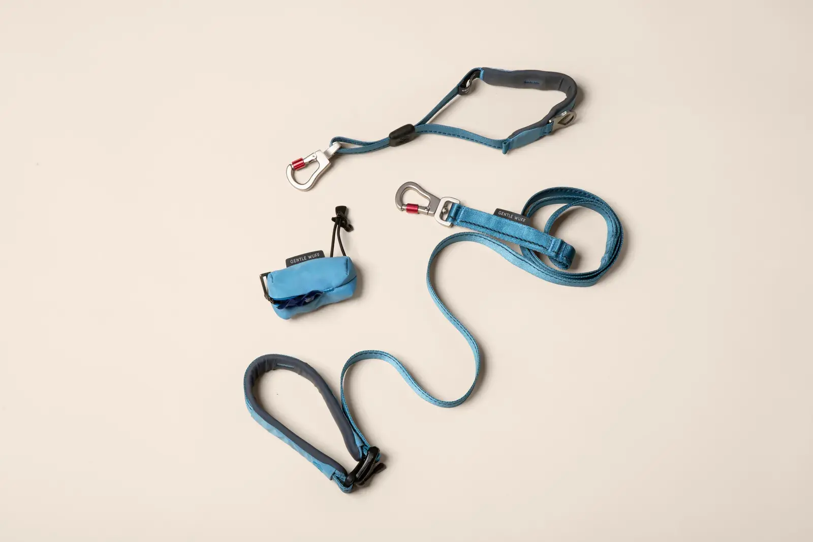Poo Pouch laid out with the leash and harness it clips into